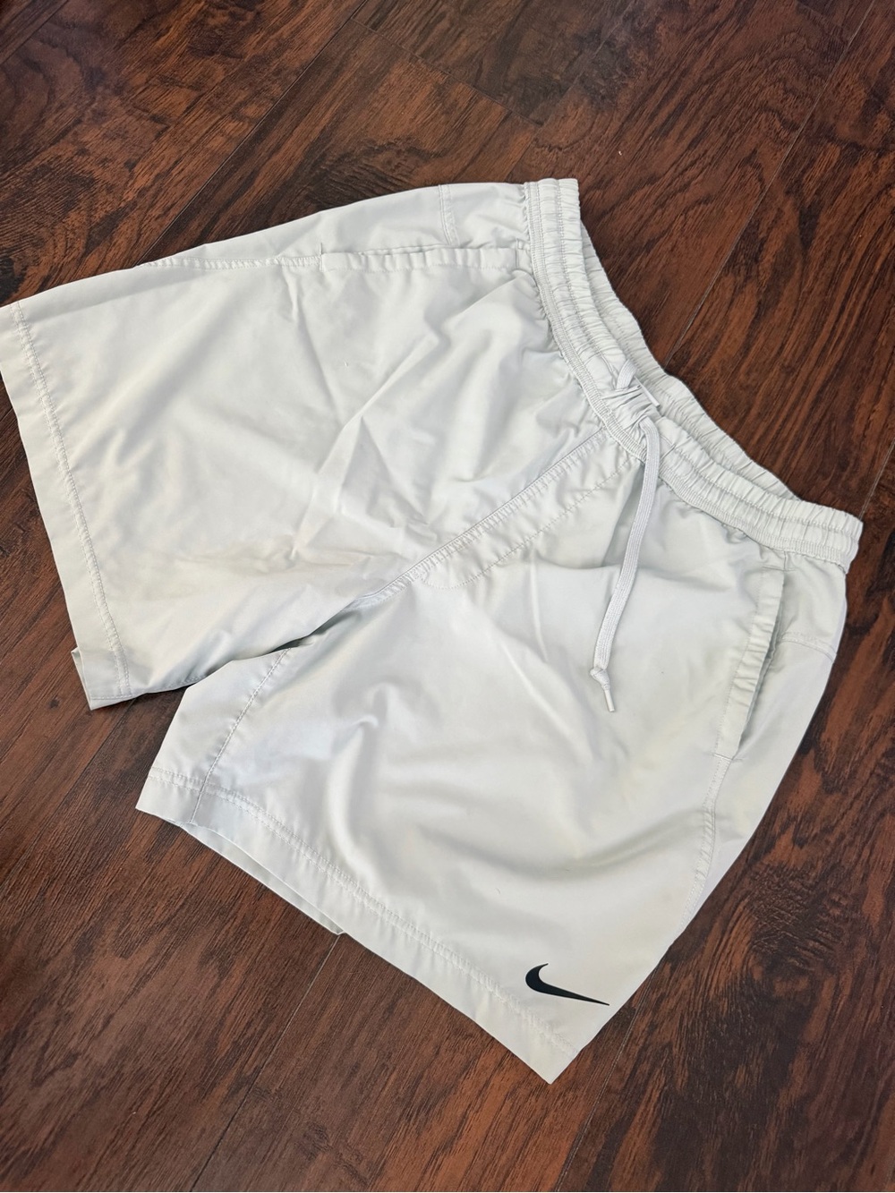 Nike Men’s Light White Athletic Shorts with Black Swoosh